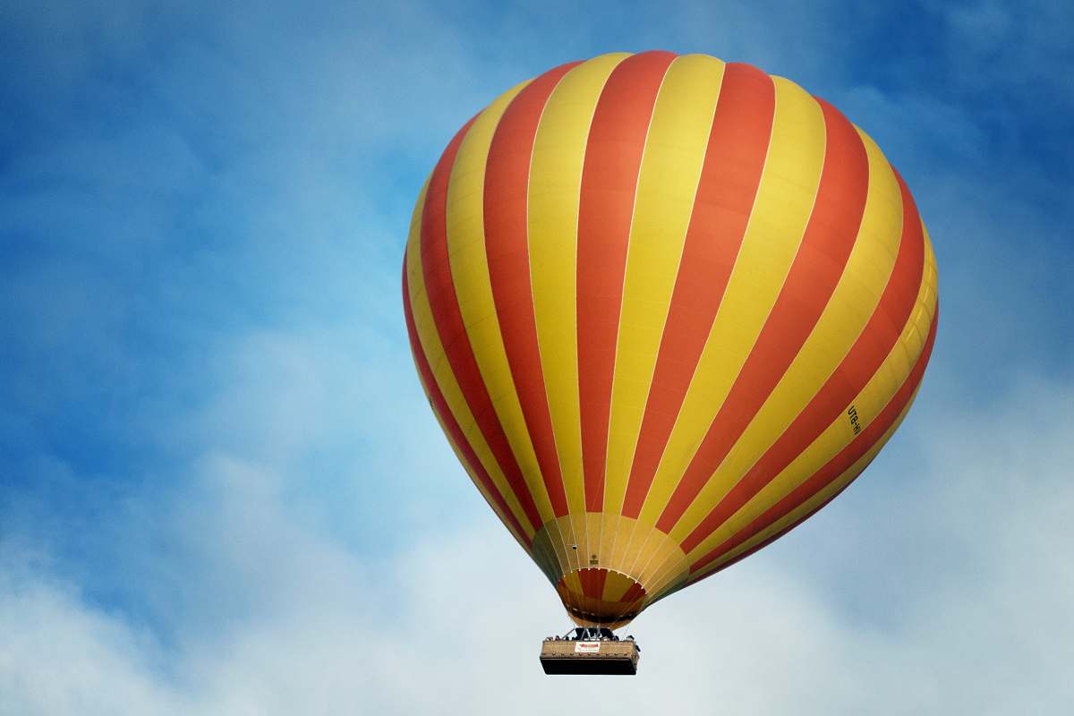 balloon low angle photography of yellow and red stripe hot air balloon aircraft